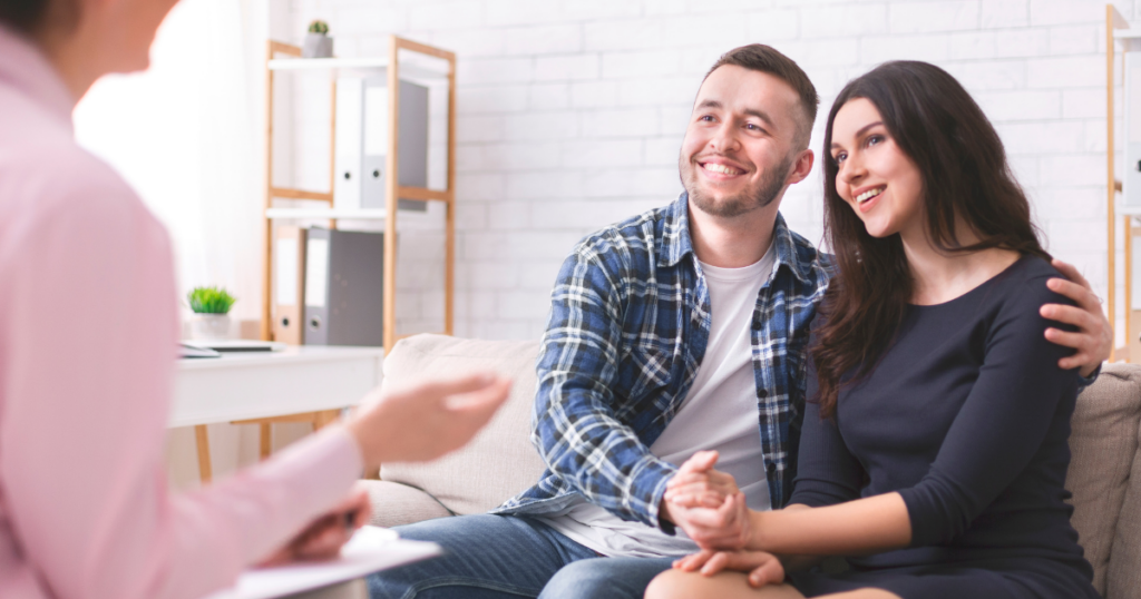 Couple reviewing spousal sponsorship documents
